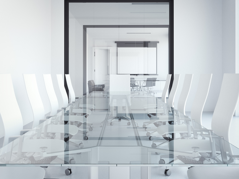 White modern meeting room with glass table.